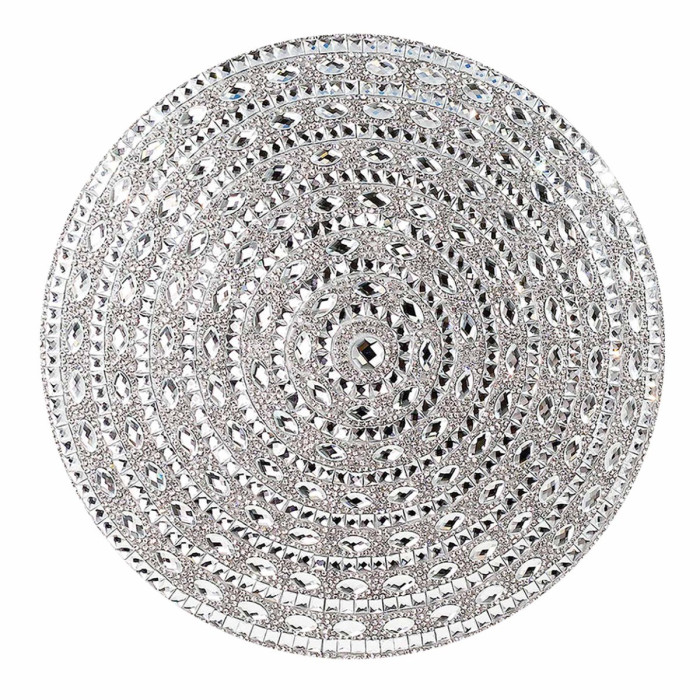 Round silver pillow with a plush velvet texture featuring intricate rhinestone embellishments in a spiral pattern.