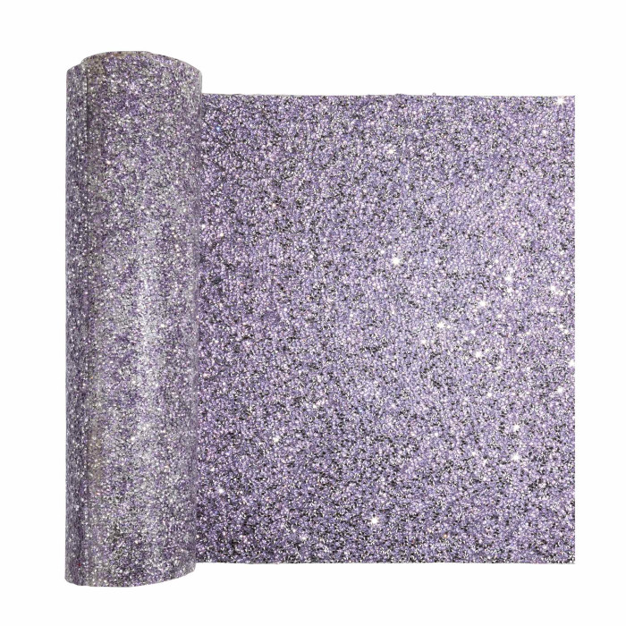A lavender table runner with a textured surface featuring sparkling rhinestones in various colors and a wavy edge.