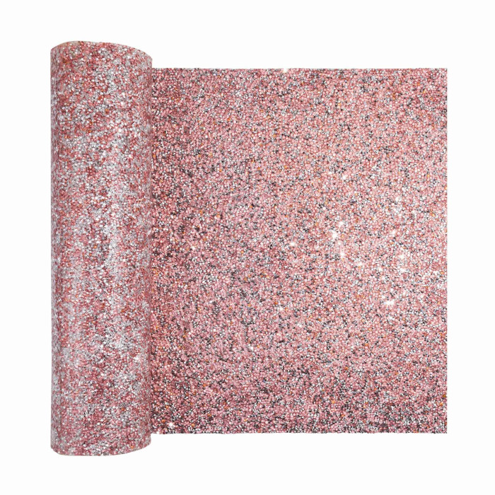 Pink table runner with a shimmering textured surface featuring sparkling rhinestones in various colors throughout.