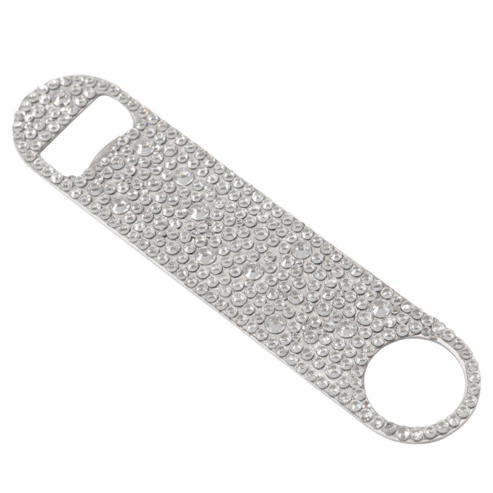Rhinestone-encrusted stainless steel bottle opener with a flat elongated shape and circular end for leverage.