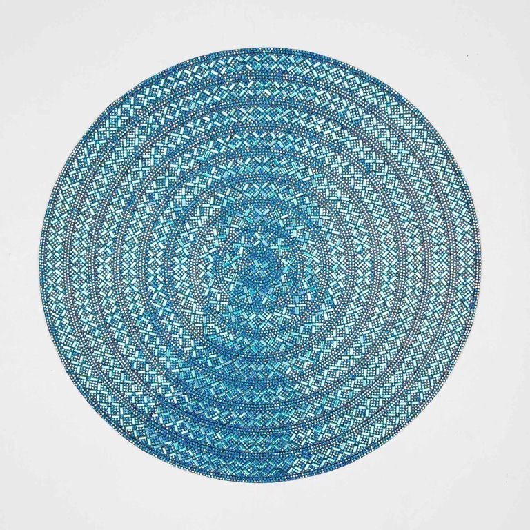 Round aqua iridescent Madison Avenue placemat with intricate geometric beaded pattern