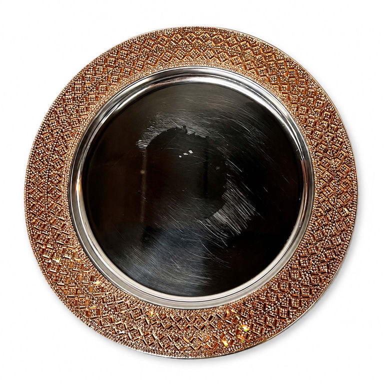 Gold charger plate with a rhinestone-patterned border and visible scratches across the dark center surface
