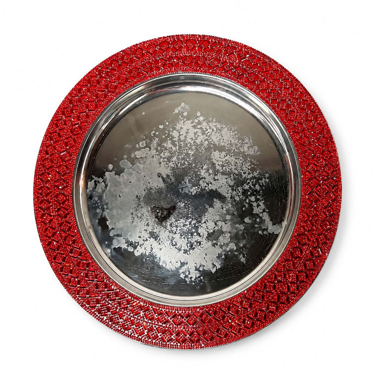 Red stone charger plate with rhinestone rim and visibly damaged silver center