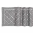Red woven table runner featuring a diamond pattern embellished with glass rhinestones. Red woven table runner featuring a diamond pattern embellished with glass rhinestones.