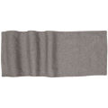 Woven table runner in textured gray fabric with a subtle heather pattern and wavy edges. Woven table runner in textured gray fabric with a subtle heather pattern and wavy edges.