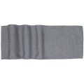 Woven table runner in textured gray fabric with a subtle heather pattern and wavy edges.