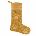 Gold glitter stocking with a tan velvet cuff and three tan paw prints on the body.