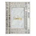 Silver rectangular picture frame with mirrored embellishments and rhinestone trim featuring a marble-patterned background. Silver rectangular picture frame with mirrored embellishments and rhinestone trim featuring a marble-patterned background.