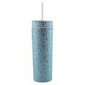 A tall silver tumbler covered in rhinestones with a clear straw and a smooth shiny surface. A tall silver tumbler covered in rhinestones with a clear straw and a smooth shiny surface.