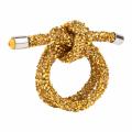 Silver wire napkin ring shaped as a knot embellished with rhinestones and featuring smooth metallic ends.