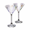 Iridescent glass martini glass with a crystal-filled stem and a faceted clear base. Iridescent glass martini glass with a crystal-filled stem and a faceted clear base.