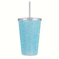 A pink acrylic tumbler covered in rhinestones featuring a silver lid and straw with a textured sparkling surface. A pink acrylic tumbler covered in rhinestones featuring a silver lid and straw with a textured sparkling surface.