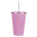 A pink acrylic tumbler covered in rhinestones featuring a silver lid and straw with a textured sparkling surface. A pink acrylic tumbler covered in rhinestones featuring a silver lid and straw with a textured sparkling surface.