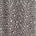 A tube of clear adhesive beside a clear pouch filled with silver and iridescent rhinestones of various sizes and shapes. A tube of clear adhesive beside a clear pouch filled with silver and iridescent rhinestones of various sizes and shapes.
