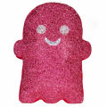 Silver glitter ghost-shaped pillow with black eyes and a smiling mouth featuring a plush texture and a white border.