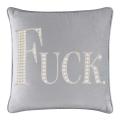 White velvet pillow with large rhinestone and faux pearl lettering spelling "FUCK" in silver embellishments.