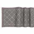 Red woven table runner featuring a diamond pattern embellished with glass rhinestones. Red woven table runner featuring a diamond pattern embellished with glass rhinestones.