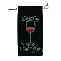 Black velvet wine bag with rhinestone embellishments featuring a wine glass and red wine design secured with a drawstring. Black velvet wine bag with rhinestone embellishments featuring a wine glass and red wine design secured with a drawstring.