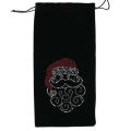 Red velvet wine bag featuring a rhinestone Santa design with curly beard and hat drawstring closure at the top. Red velvet wine bag featuring a rhinestone Santa design with curly beard and hat drawstring closure at the top.