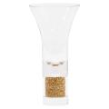 Clear glass vase with a flared top and a base filled with tiny golden crystal stones.