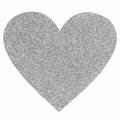 Red heart-shaped placemat with a textured surface adorned with sparkling rhinestones and a non-slip backing. Red heart-shaped placemat with a textured surface adorned with sparkling rhinestones and a non-slip backing.