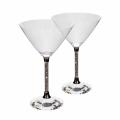 Clear crystal martini glass with a wide conical bowl a faceted base and a stem featuring embedded rhinestones. Clear crystal martini glass with a wide conical bowl a faceted base and a stem featuring embedded rhinestones.