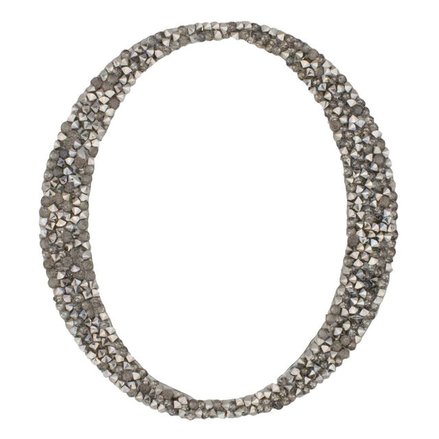 Silver script letter "L" with a textured surface embellished with small rhinestones featuring elegant curves and loops. Silver script letter "L" with a textured surface embellished with small rhinestones featuring elegant curves and loops.