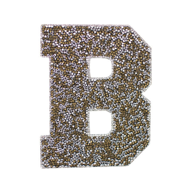Large silver block letter "A" with a textured glittery surface and a triangular cutout in the center.