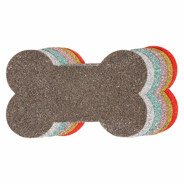 Brown glittery dog bone-shaped placemat with colorful scalloped edges in red orange yellow aqua and silver.