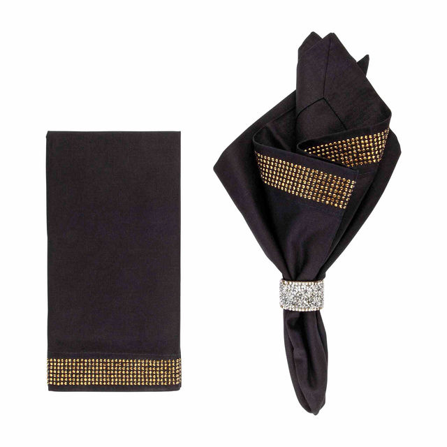 Black napkin with gold crystal rhinestone band made of linen and cotton featuring a smooth texture and elegant folds.