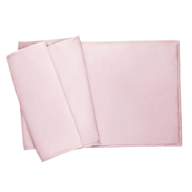 plush light gray velvet table runner with a smooth texture and folded edges. plush light gray velvet table runner with a smooth texture and folded edges.