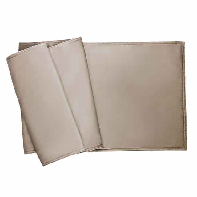 plush light gray velvet table runner with a smooth texture and folded edges. plush light gray velvet table runner with a smooth texture and folded edges.