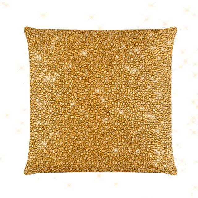 Square pillow covered in shimmering silver rhinestones on a soft velvet texture. Square pillow covered in shimmering silver rhinestones on a soft velvet texture.