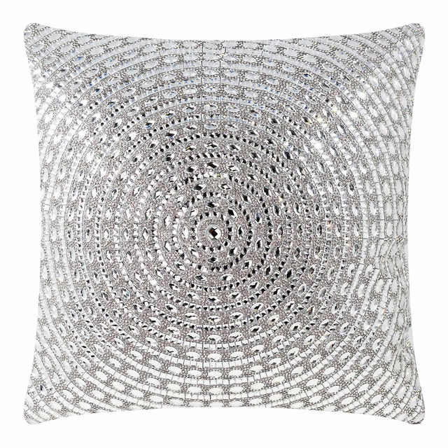 Square pillow covered in silver velvet with circular patterns of large glass rhinestones arranged in concentric circles. Square pillow covered in silver velvet with circular patterns of large glass rhinestones arranged in concentric circles.