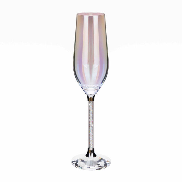 A tall clear glass toasting flute with a rainbow sheen crystal-filled stem and a faceted clear base.
