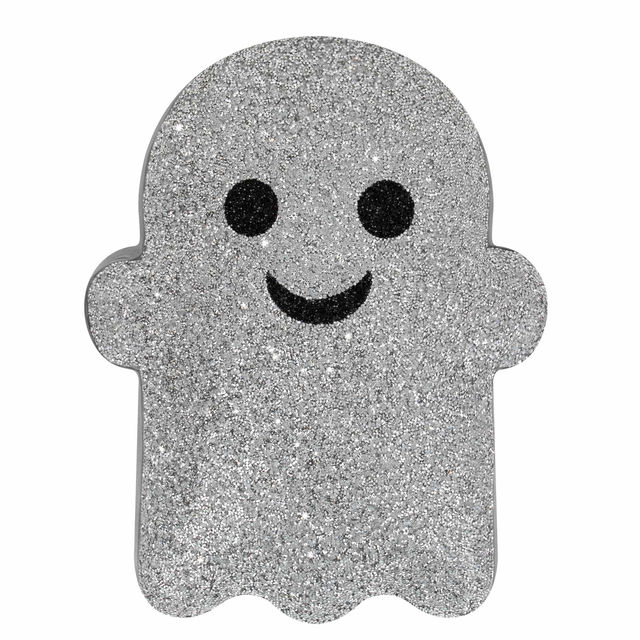 Silver glitter ghost-shaped pillow with black eyes and a smiling mouth featuring a plush texture and a white border.