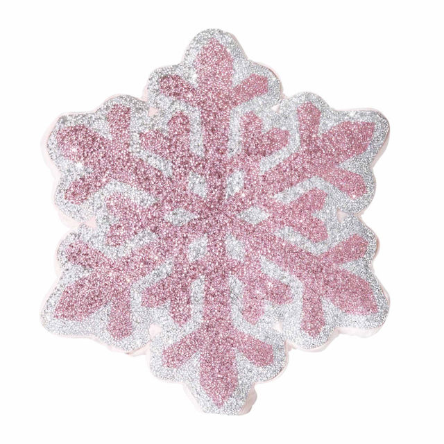 Snowflake-shaped pillow with pink glittery design and silver accents featuring a soft velvet texture on the back. Snowflake-shaped pillow with pink glittery design and silver accents featuring a soft velvet texture on the back.