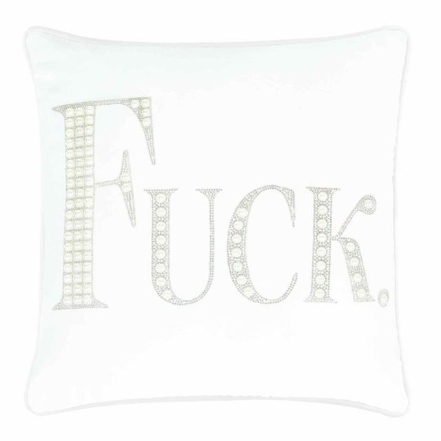 White velvet pillow with large rhinestone and faux pearl lettering spelling "FUCK" in silver embellishments.