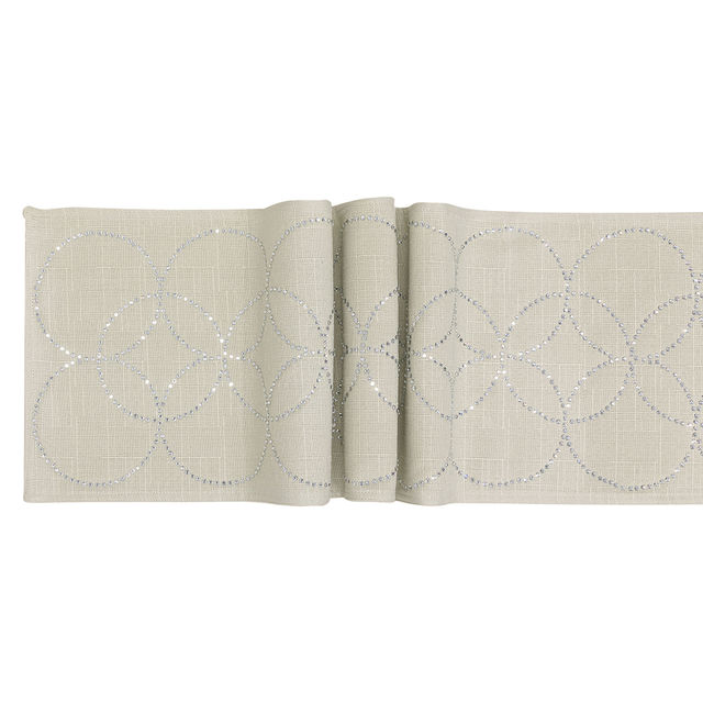 Light green linen table runner featuring overlapping circles embellished with glass rhinestones.