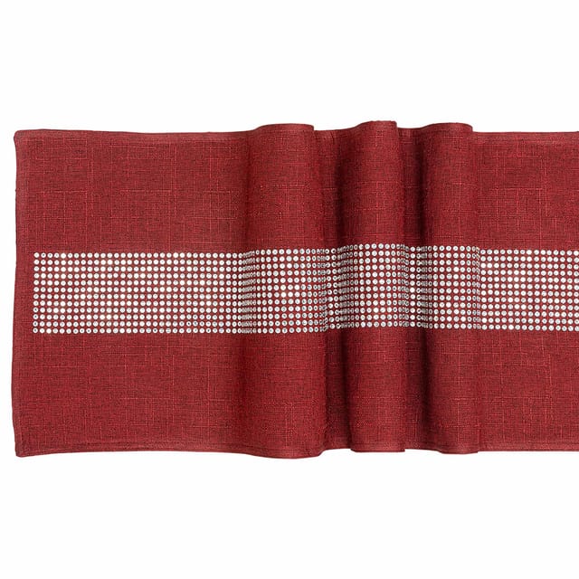 Black table runner with a textured finish and a central band of glass rhinestones arranged in a straight line.