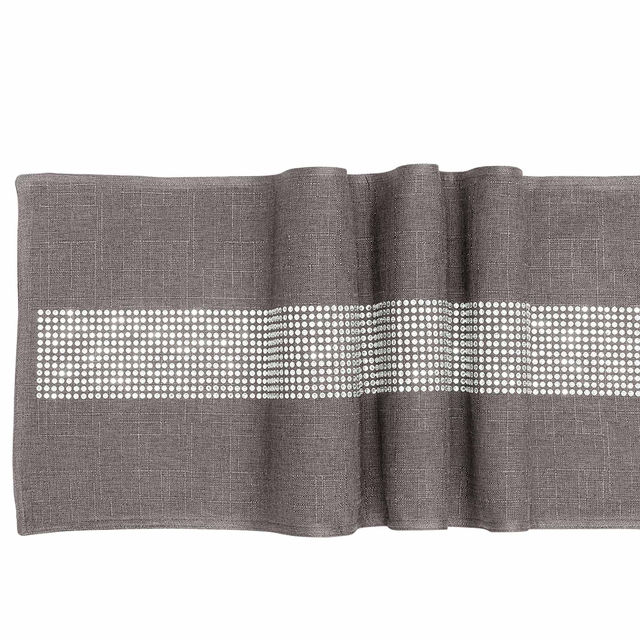 Black table runner with a textured finish and a central band of glass rhinestones arranged in a straight line. Black table runner with a textured finish and a central band of glass rhinestones arranged in a straight line.