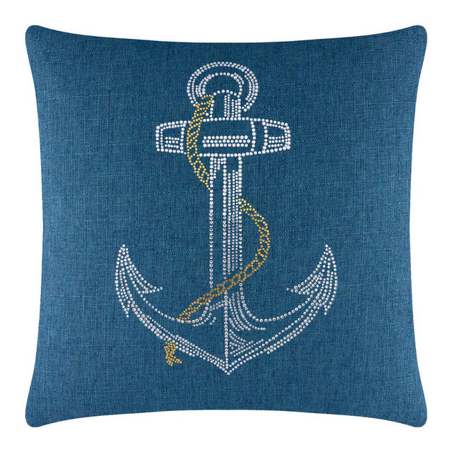 Square blue pillow featuring a rhinestone anchor design with a gold chain embellishment on a textured fabric surface.