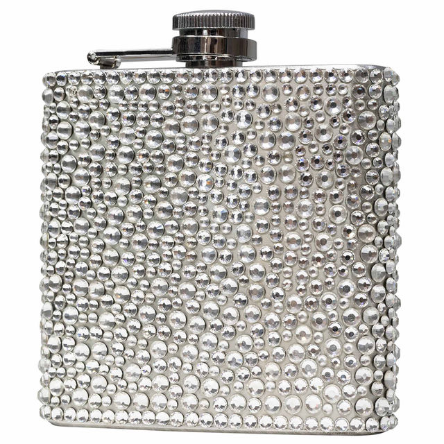 A silver flask covered in hand-applied clear rhinestones with a shiny metal screw top and a rectangular shape.