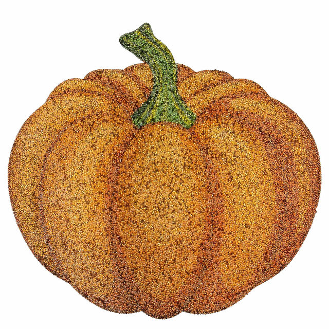 Luminous pumpkin-shaped placemat in orange with silver rhinestones and a green stem featuring a textured surface.