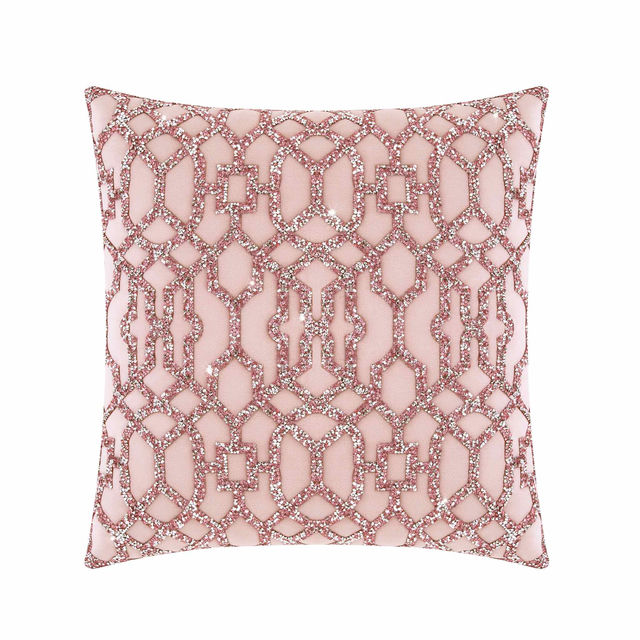 Pink velvet pillow with laser-cut rhinestones in a geometric lattice pattern featuring a plush texture and smooth finish.