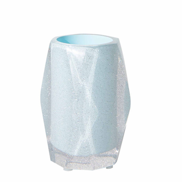 Faceted tumbler in silver and clear acrylic with a geometric shape and smooth reflective surface.