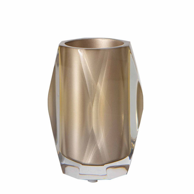 Faceted tumbler in silver and clear acrylic with a geometric shape and smooth reflective surface. Faceted tumbler in silver and clear acrylic with a geometric shape and smooth reflective surface.