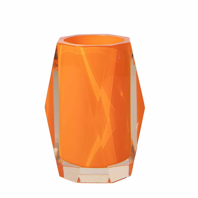 Faceted tumbler in silver and clear acrylic with a geometric shape and smooth reflective surface. Faceted tumbler in silver and clear acrylic with a geometric shape and smooth reflective surface.