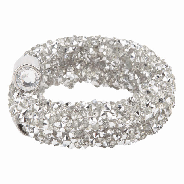 Gold napkin ring made of flexible wire adorned with sparkling golden crystals and silver metal accents.