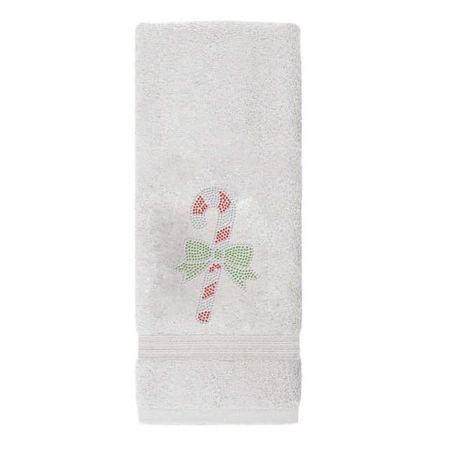 Red cotton hand towel featuring a rhinestone candy cane motif with a bow textured surface measures 30"x16". Red cotton hand towel featuring a rhinestone candy cane motif with a bow textured surface measures 30"x16".